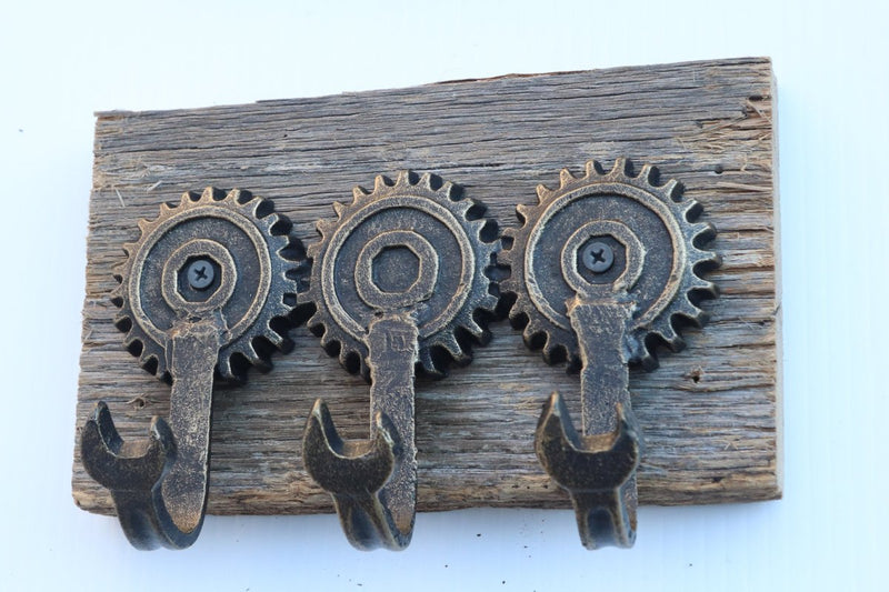 https://knoxdeco.com/cdn/shop/products/steampunk-cogs-wall-hanger-wrench-hooks-metal-cast-iron-hat-rack-rustic-deco-925105_800x.jpg?v=1651081551